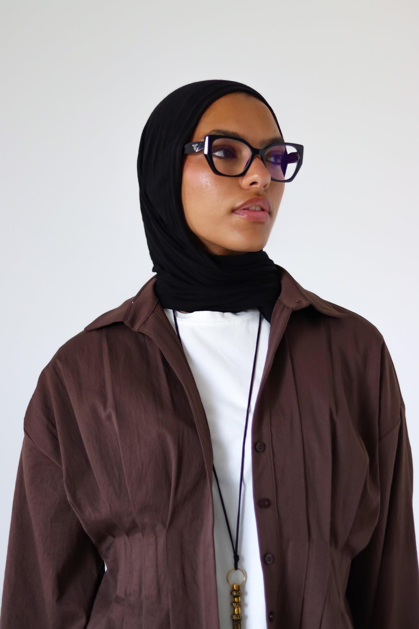 Pleated Round Shirt — Brown